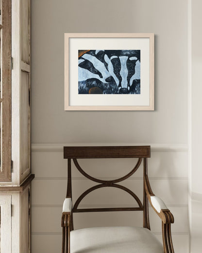 Natural wood A2 badger art print on a pale grey hallway wall with white panelled wainscoting beside a walnut Regency armchair in cream.