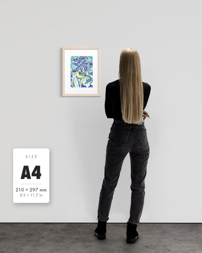 Andrea Nicole 'Taking Flight' blue tit art print in a natural wood A4 frame shown to scale beside a standing woman on a gallery wall, with an A4 (210 × 297 mm) size label. | an:family=print;role=sizeref;size=A4;finish=natural