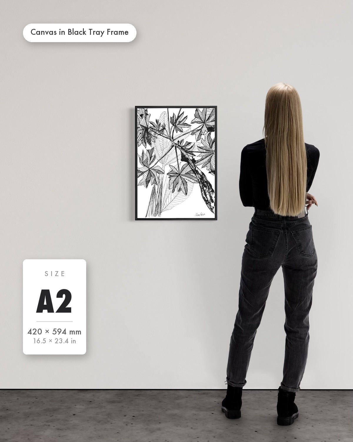 Andrea Nicole 'Banana Grove' fine art canvas in a black tray float frame, A2 — shown to scale on a gallery wall with a size guide card. | an:family=canvas;role=sizeref;size=A2;finish=black