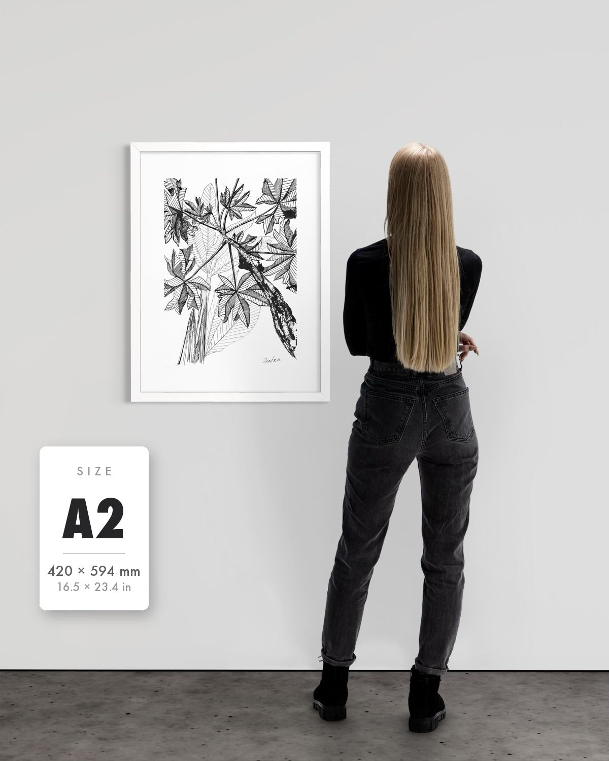 Banana Grove — A2 (420 x 594 mm) white frame art print shown to scale beside a person, with a size guide card. | an:family=print;role=sizeref;size=A2;finish=white