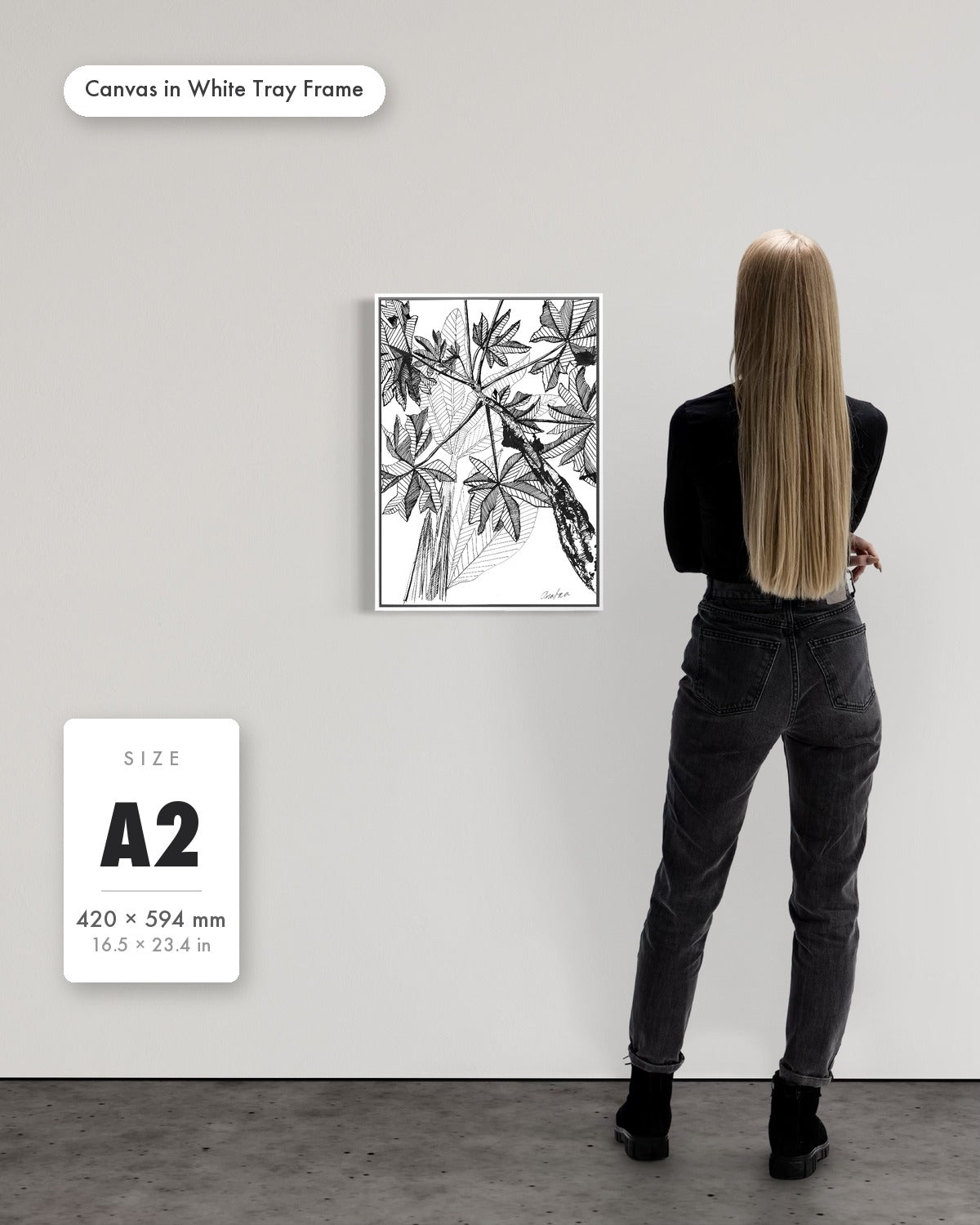 Andrea Nicole 'Banana Grove' fine art canvas in a white tray float frame, A2 — shown to scale on a gallery wall with a size guide card. | an:family=canvas;role=sizeref;size=A2;finish=white