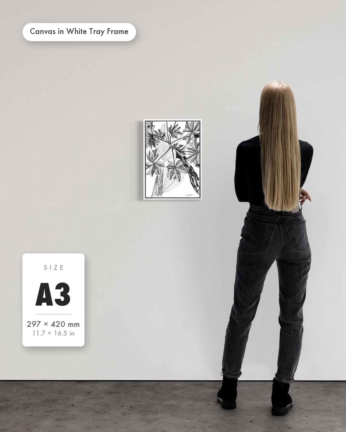 Andrea Nicole 'Banana Grove' fine art canvas in a white tray float frame, A3 — shown to scale on a gallery wall with a size guide card. | an:family=canvas;role=sizeref;size=A3;finish=white
