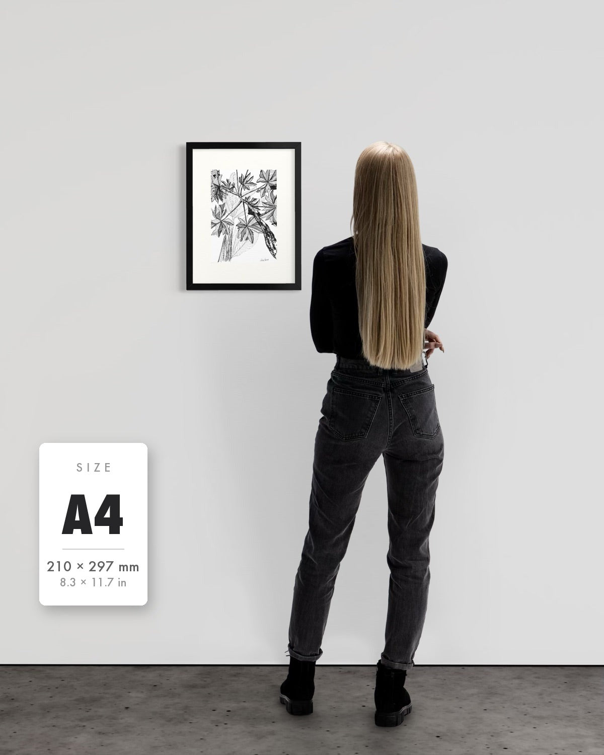 Banana Grove — A4 (210 x 297 mm) black frame art print shown to scale beside a person, with a size guide card. | an:family=print;role=sizeref;size=A4;finish=black
