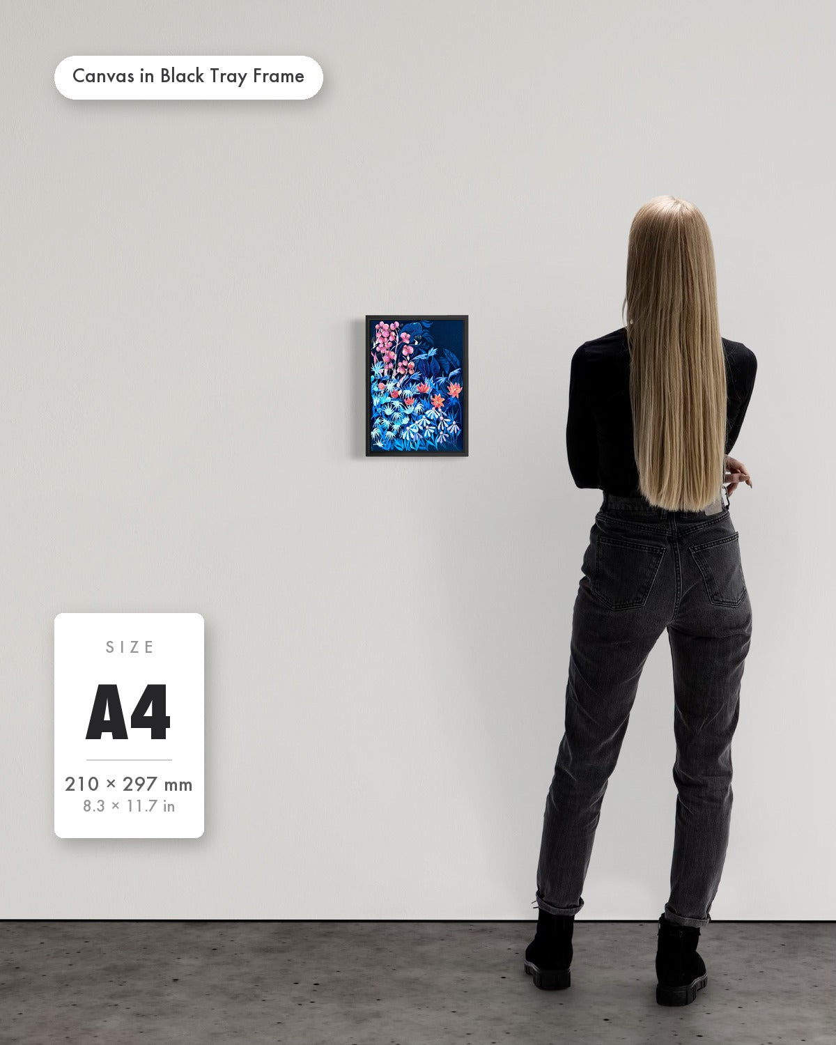 Andrea Nicole 'Emerging Through Fear' fine art canvas in a black tray float frame, A4 — shown to scale on a gallery wall with a size guide card. | an:family=canvas;role=sizeref;size=A4;finish=black