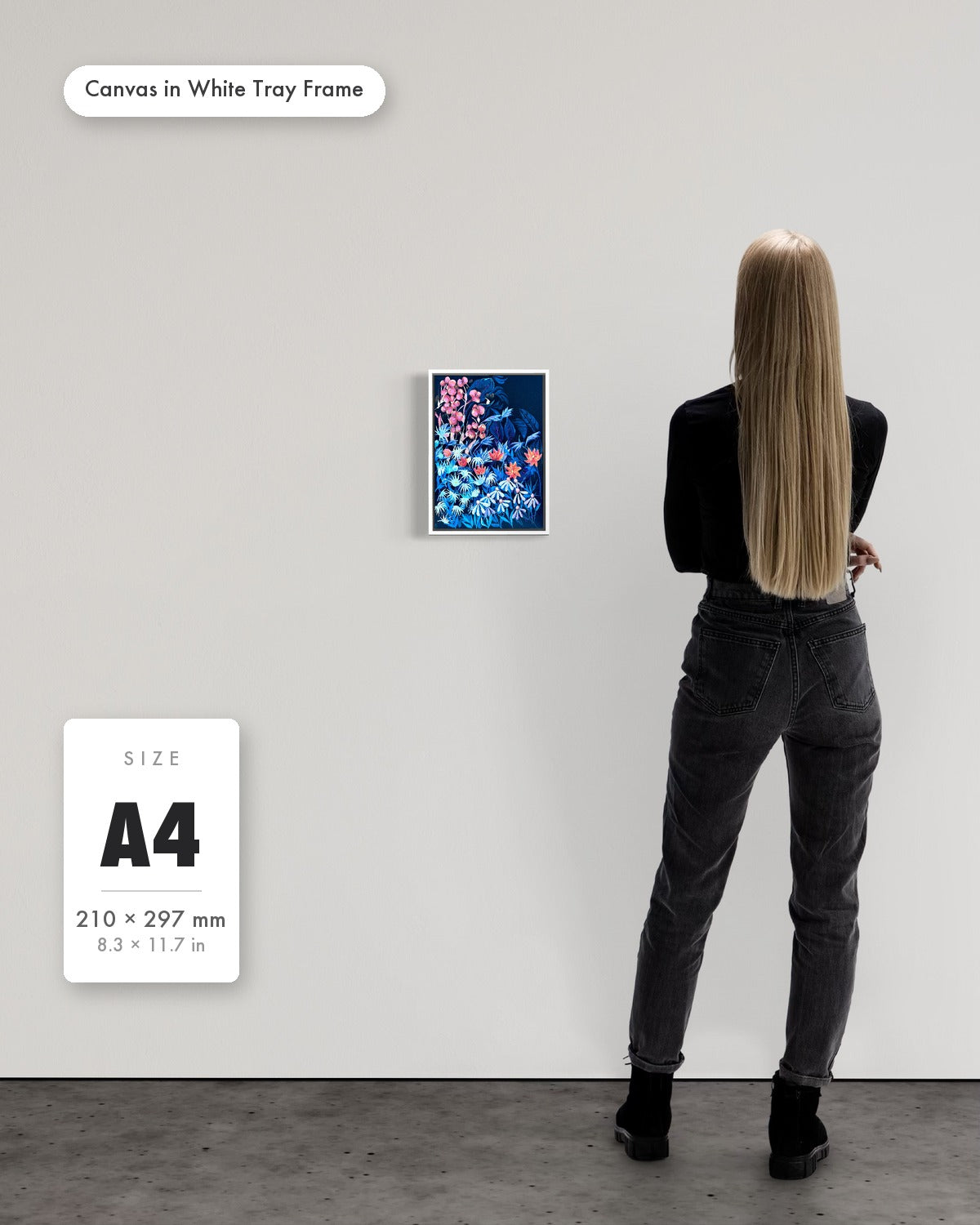 Andrea Nicole 'Emerging Through Fear' fine art canvas in a white tray float frame, A4 — shown to scale on a gallery wall with a size guide card. | an:family=canvas;role=sizeref;size=A4;finish=white