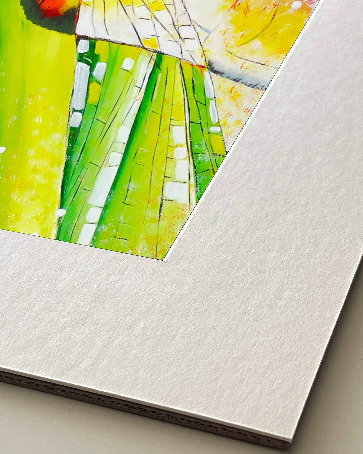 Andrea Nicole 'Just For a Moment' giclée fine art print in an off-white window mount, shown corner-on so the bevel-cut window opening, 100% cotton paper and mount board are visible. | an:family=print;role=mount