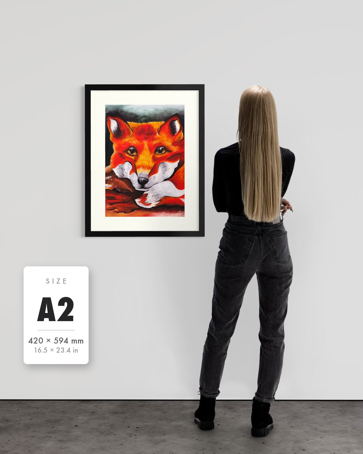 Quiet Curiosity — A2 (420 x 594 mm) black frame art print shown to scale beside a person, with a size guide card. | an:family=print;role=sizeref;size=A2;finish=black