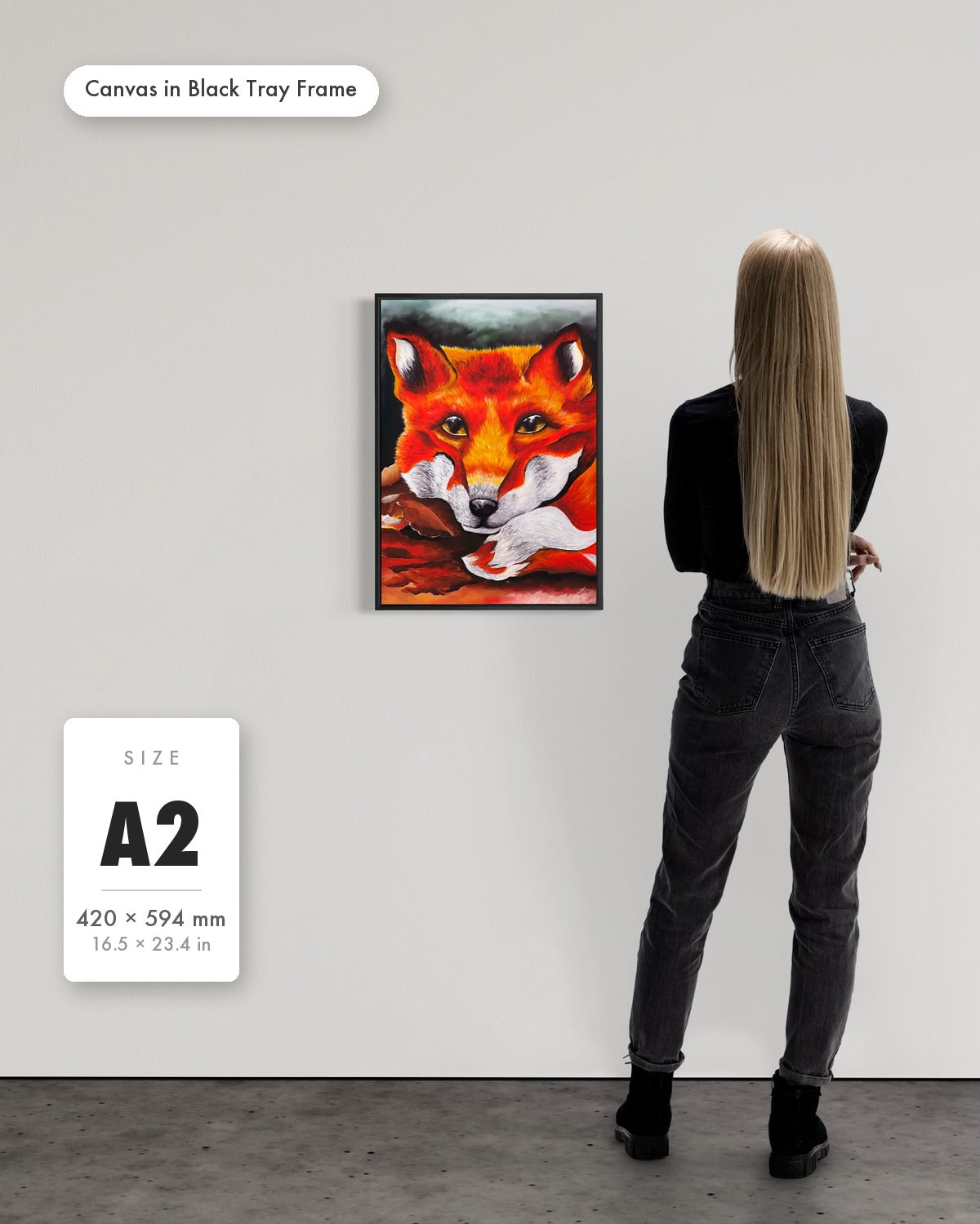 Andrea Nicole 'Quiet Curiosity' fine art canvas in a black tray float frame, A2 — shown to scale on a gallery wall with a size guide card. | an:family=canvas;role=sizeref;size=A2;finish=black