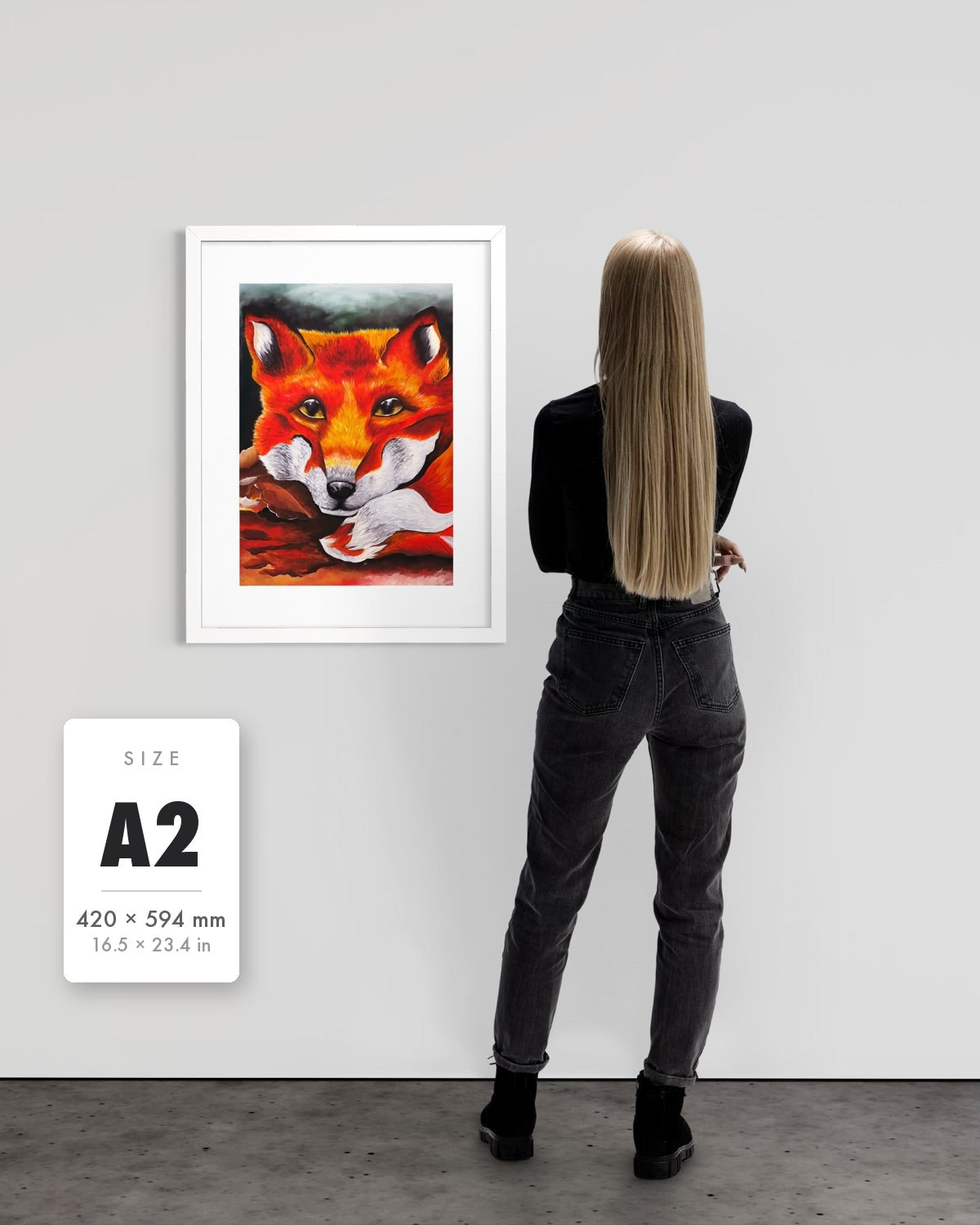Quiet Curiosity — A2 (420 x 594 mm) white frame art print shown to scale beside a person, with a size guide card. | an:family=print;role=sizeref;size=A2;finish=white