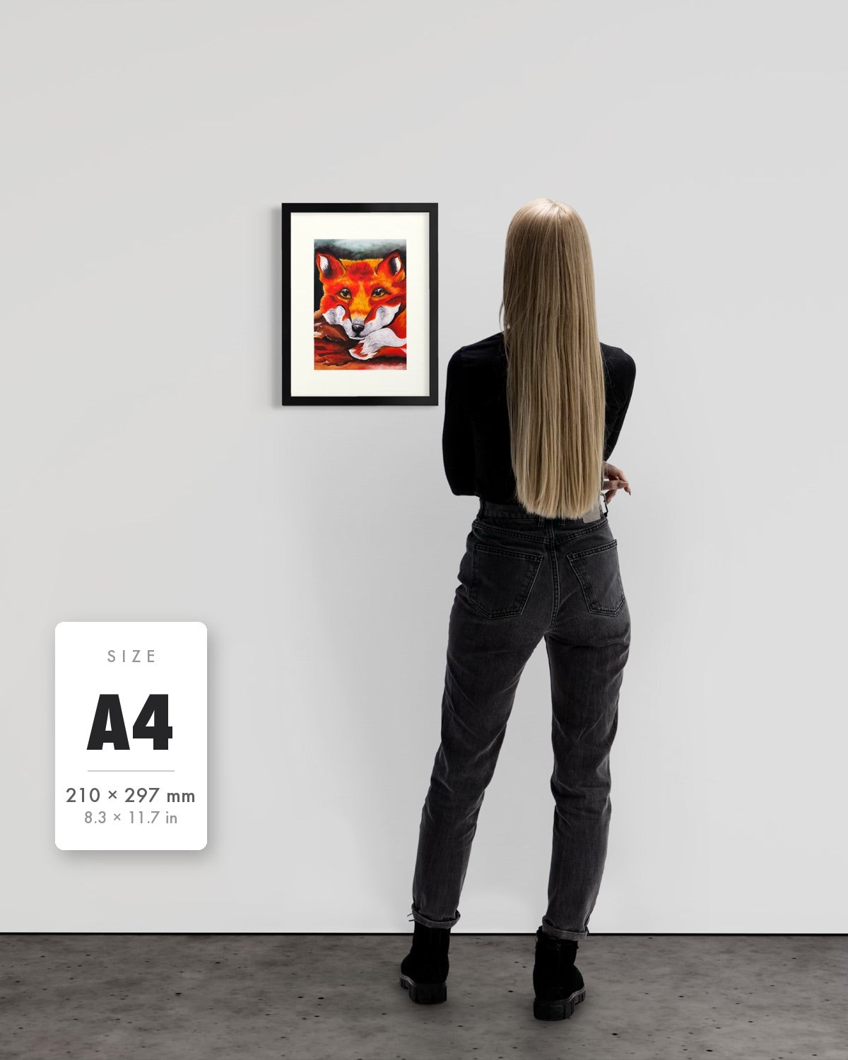 Quiet Curiosity — A4 (210 x 297 mm) black frame art print shown to scale beside a person, with a size guide card. | an:family=print;role=sizeref;size=A4;finish=black