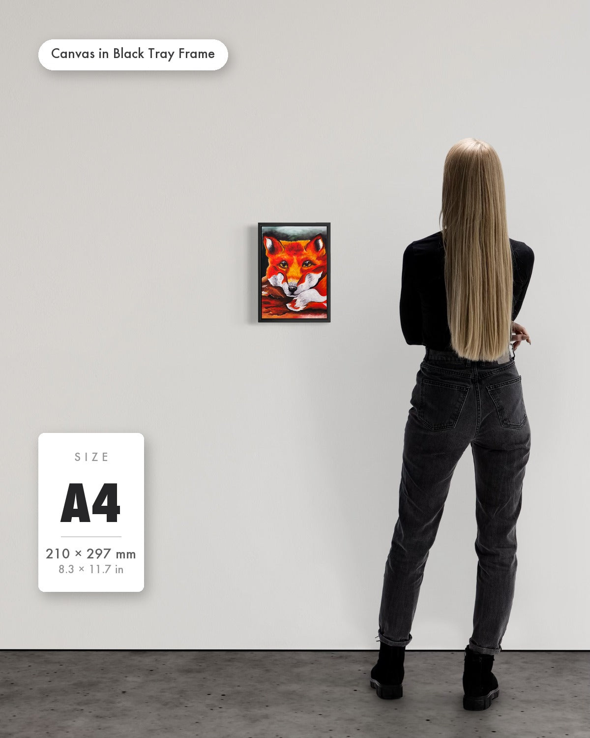 Andrea Nicole 'Quiet Curiosity' fine art canvas in a black tray float frame, A4 — shown to scale on a gallery wall with a size guide card. | an:family=canvas;role=sizeref;size=A4;finish=black