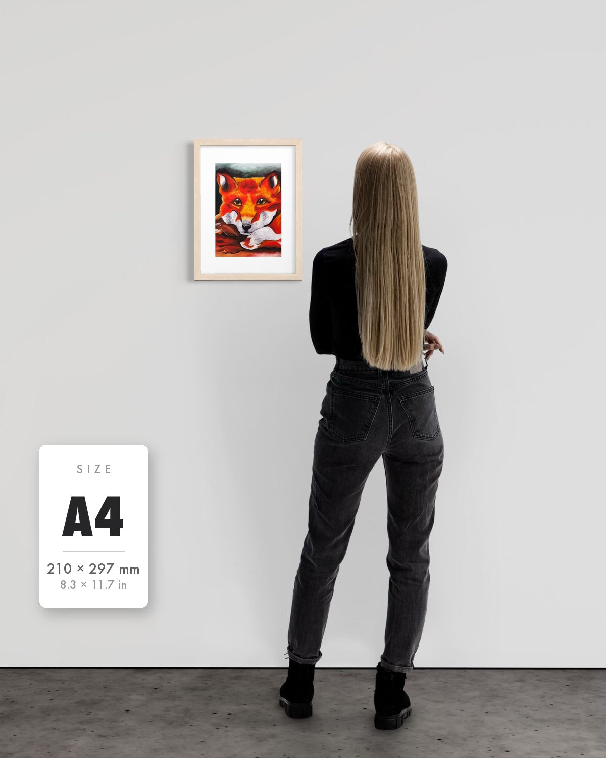 Quiet Curiosity — A4 (210 x 297 mm) natural frame art print shown to scale beside a person, with a size guide card. | an:family=print;role=sizeref;size=A4;finish=natural