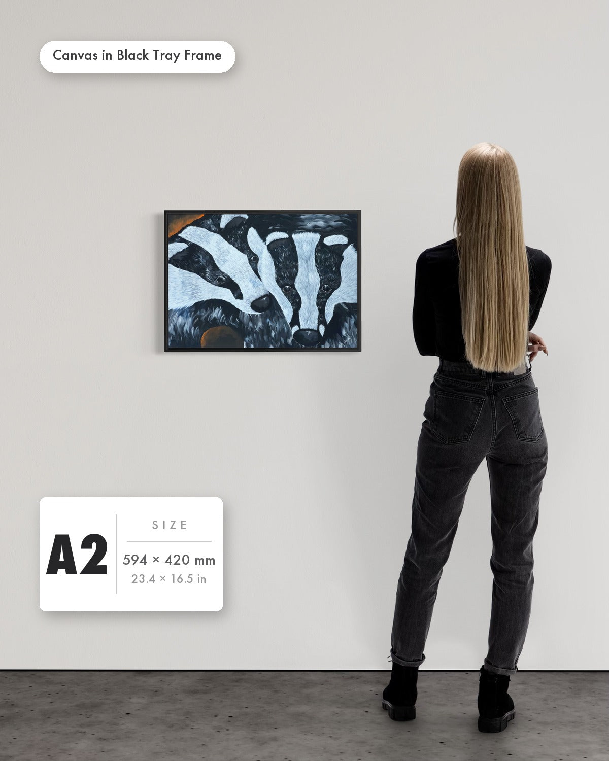 Andrea Nicole 'Secret Whispers' fine art canvas in a black tray float frame, A2 — shown to scale on a gallery wall with a size guide card. | an:family=canvas;role=sizeref;size=A2;finish=black