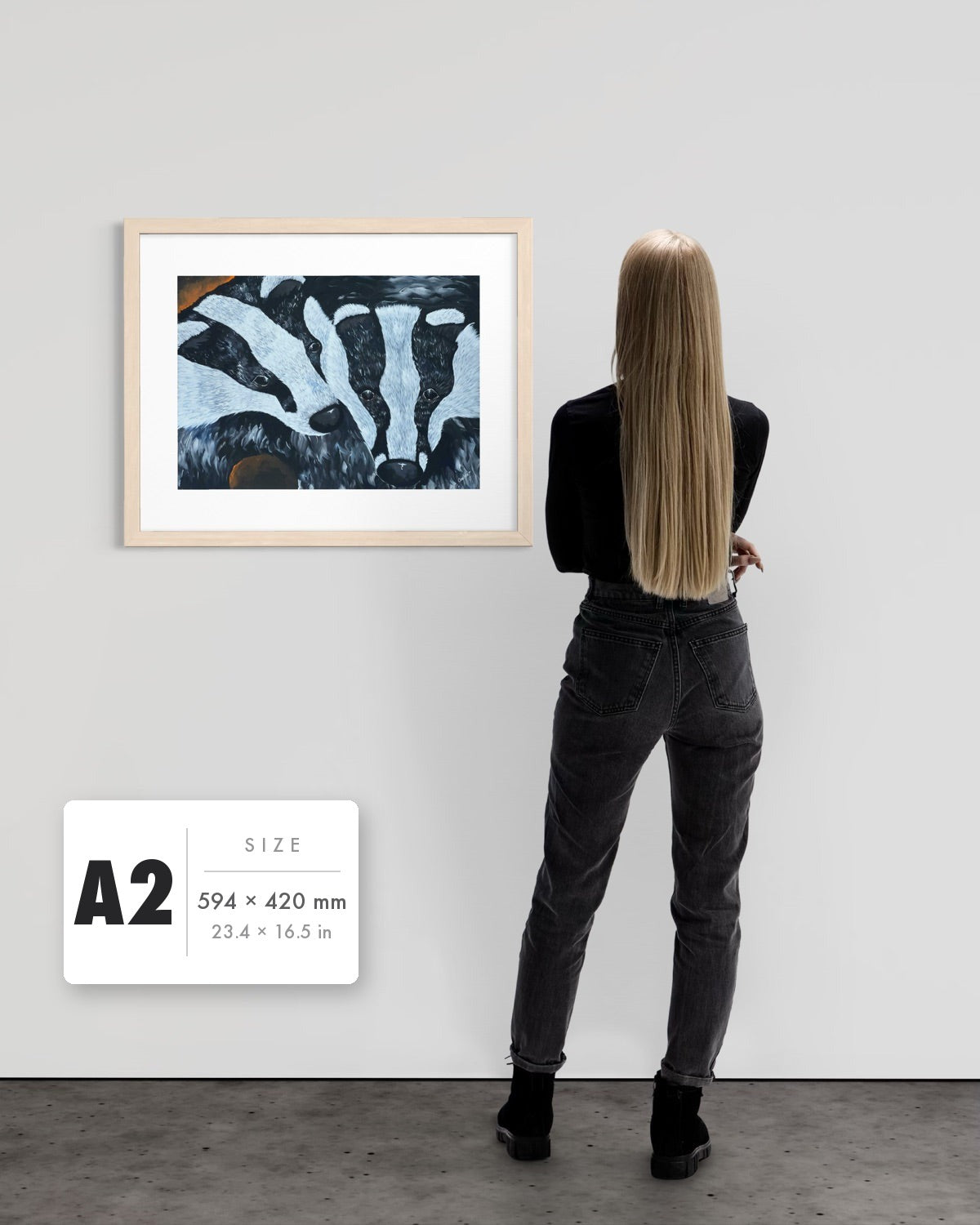 Secret Whispers — A2 (594 x 420 mm) natural frame art print shown to scale beside a person, with a size guide card. | an:family=print;role=sizeref;size=A2;finish=natural