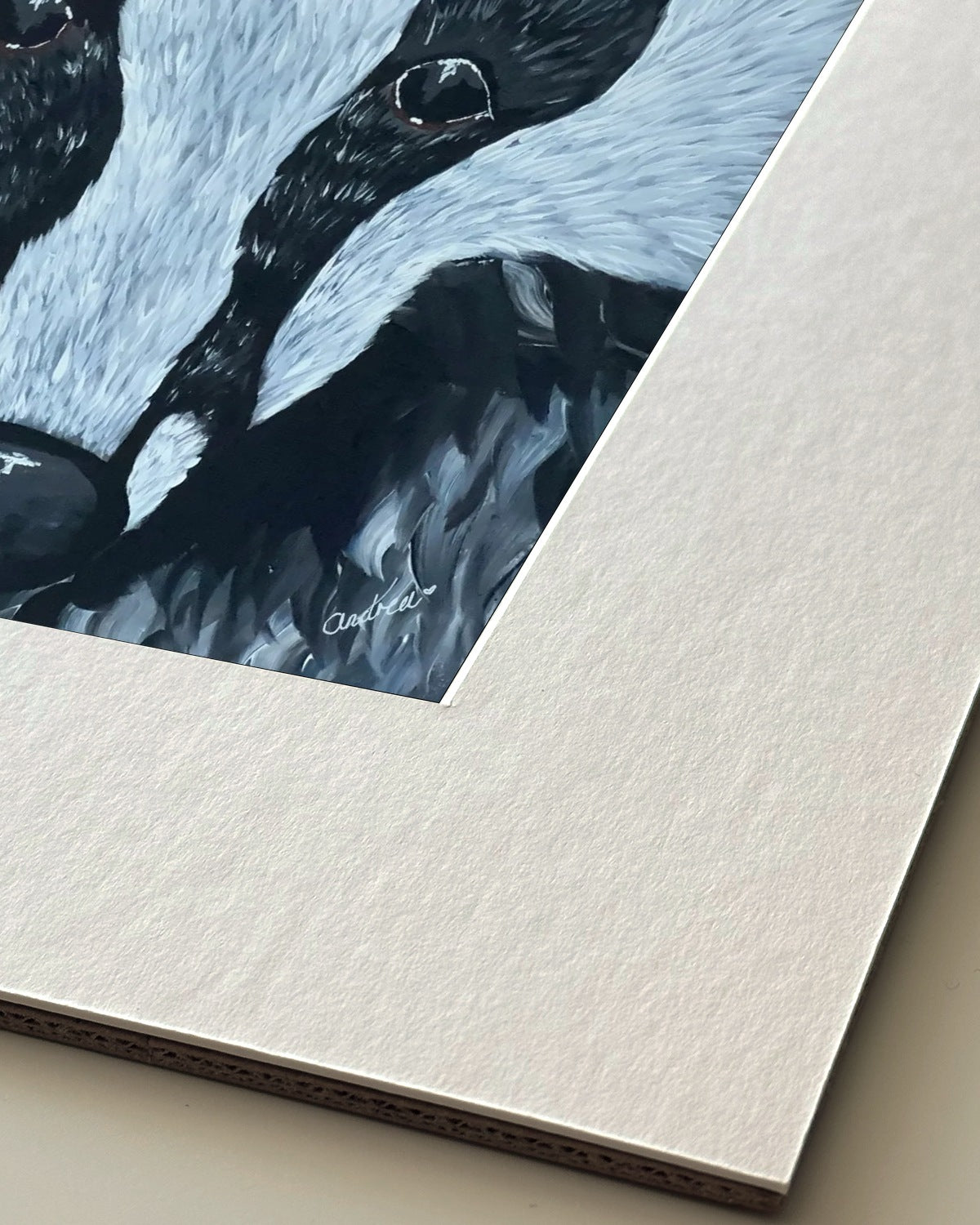 Andrea Nicole 'Secret Whispers' giclée fine art print in an off-white window mount, shown corner-on so the bevel-cut window opening, 100% cotton paper and mount board are visible. | an:family=print;role=mount