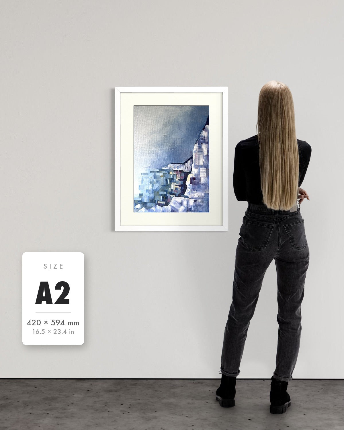 Solitude — A2 (420 x 594 mm) white frame art print shown to scale beside a person, with a size guide card. | an:family=print;role=sizeref;size=A2;finish=white