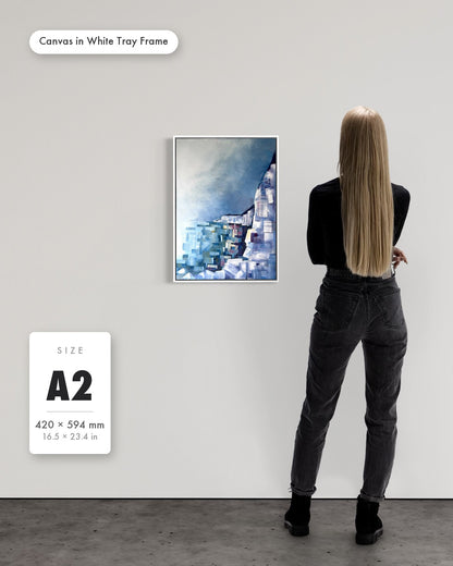 Andrea Nicole 'Solitude' fine art canvas in a white tray float frame, A2 — shown to scale on a gallery wall with a size guide card. | an:family=canvas;role=sizeref;size=A2;finish=white
