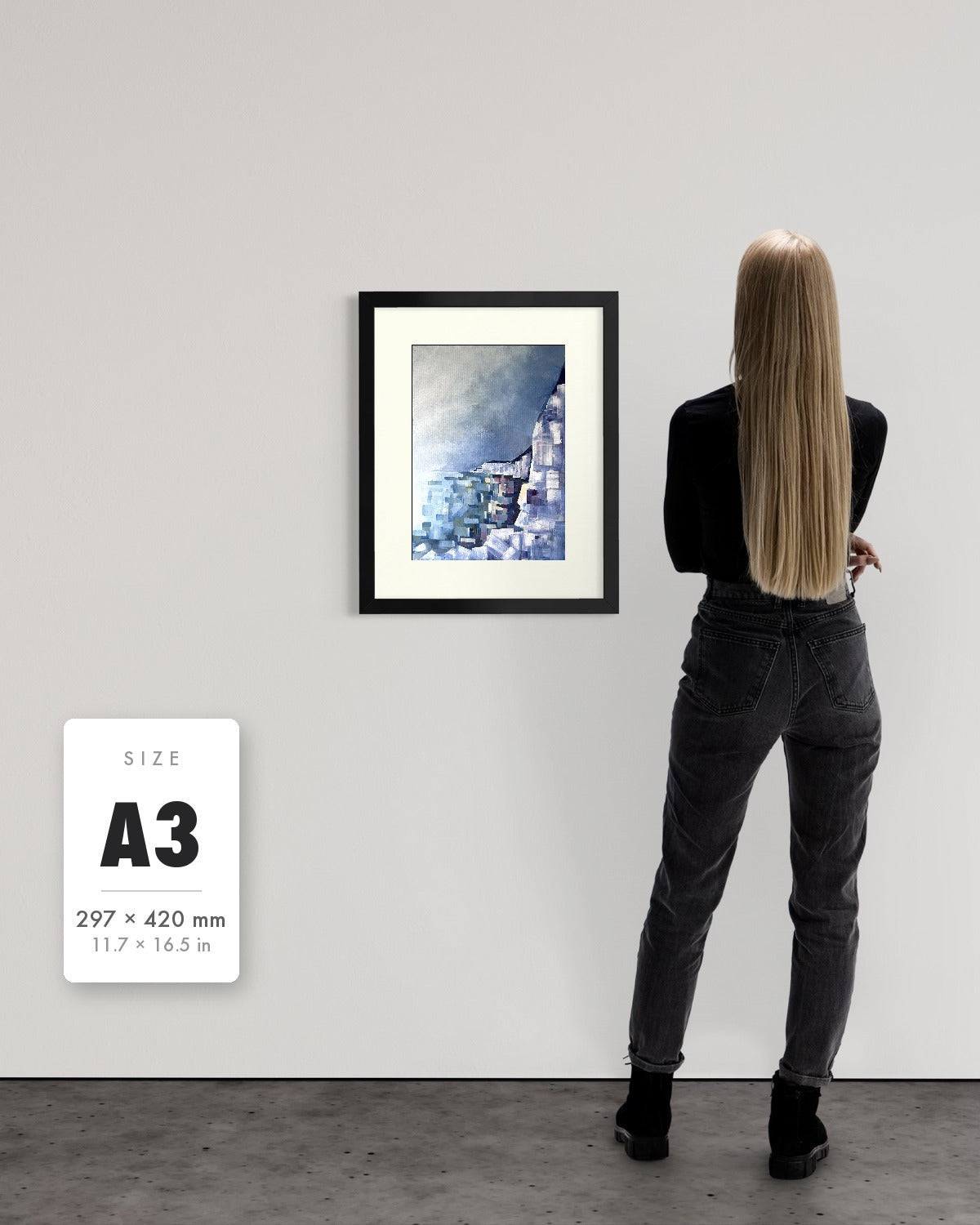 Solitude — A3 (297 x 420 mm) black frame art print shown to scale beside a person, with a size guide card. | an:family=print;role=sizeref;size=A3;finish=black