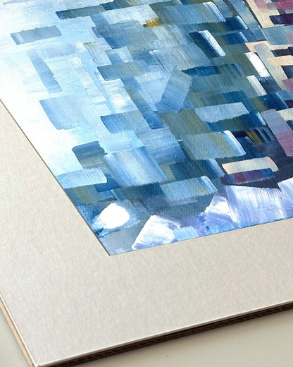 Andrea Nicole 'Solitude' giclée fine art print in an off-white window mount, shown corner-on so the bevel-cut window opening, 100% cotton paper and mount board are visible. | an:family=print;role=mount