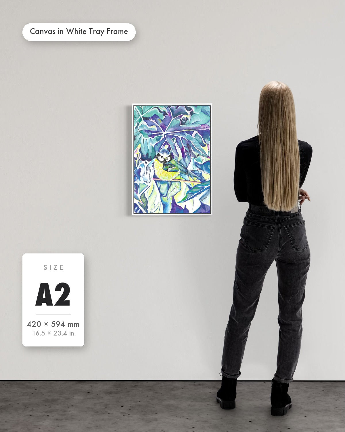 Andrea Nicole 'Taking Flight' fine art canvas in a white tray float frame, A2 — shown to scale on a gallery wall with a size guide card. | an:family=canvas;role=sizeref;size=A2;finish=white