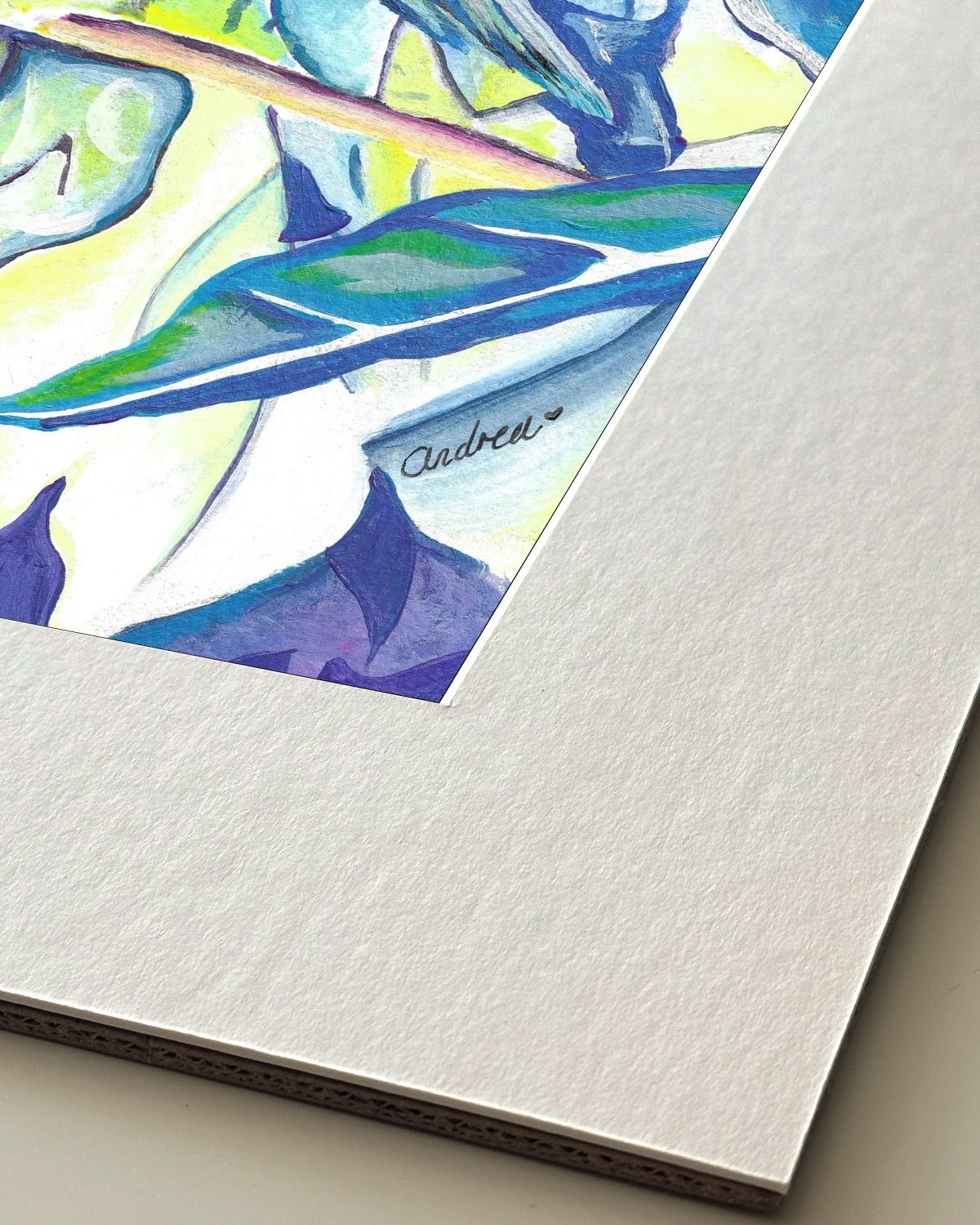 Andrea Nicole 'Taking Flight' giclée fine art print in an off-white window mount, shown corner-on so the bevel-cut window opening, 100% cotton paper and mount board are visible. | an:family=print;role=mount