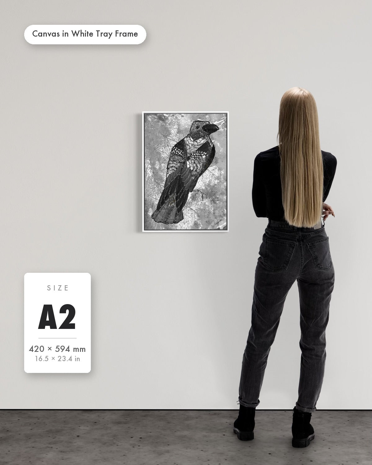 Andrea Nicole 'The Journey to Transformation' fine art canvas in a white tray float frame, A2 — shown to scale on a gallery wall with a size guide card. | an:family=canvas;role=sizeref;size=A2;finish=white