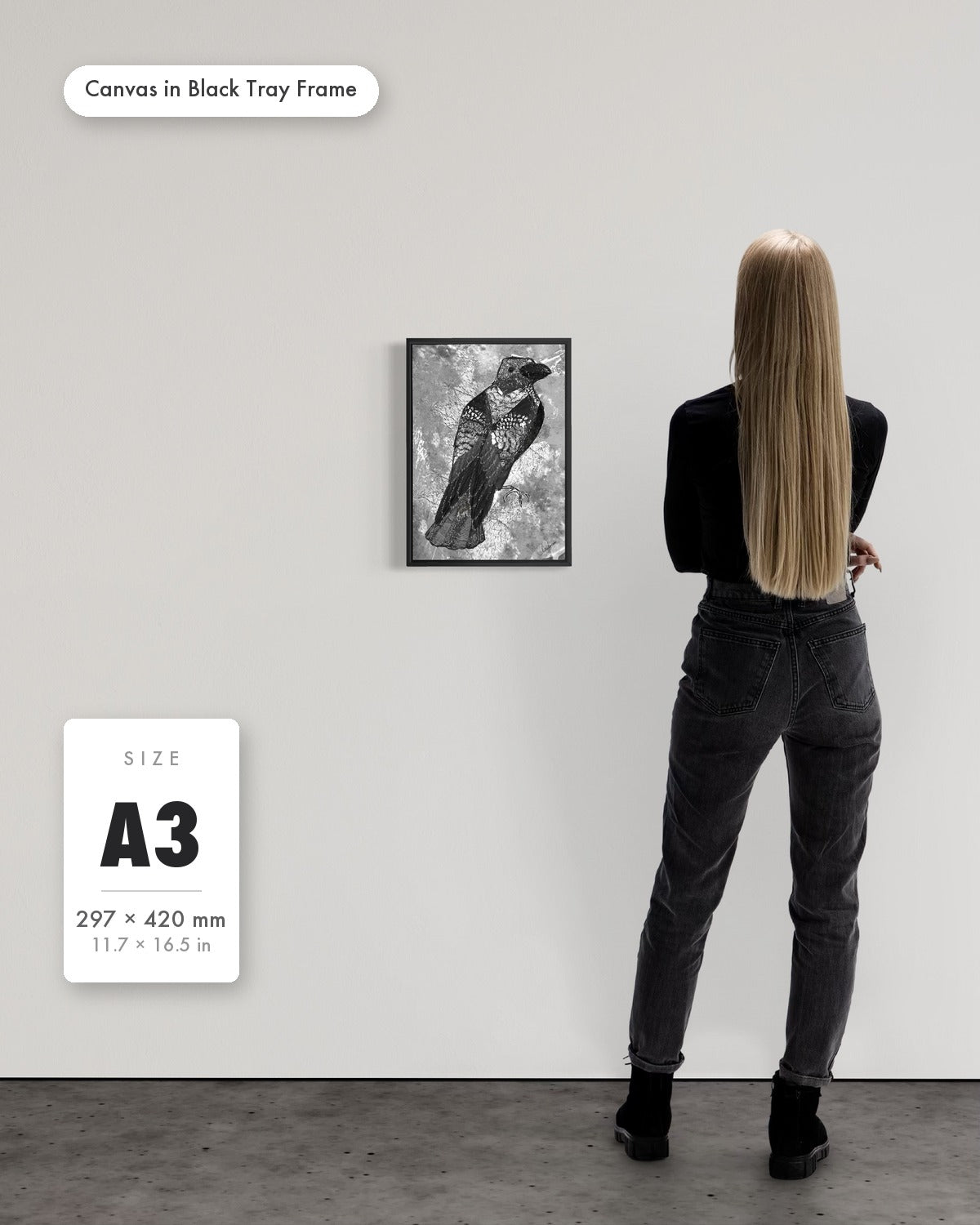 Andrea Nicole 'The Journey to Transformation' fine art canvas in a black tray float frame, A3 — shown to scale on a gallery wall with a size guide card. | an:family=canvas;role=sizeref;size=A3;finish=black