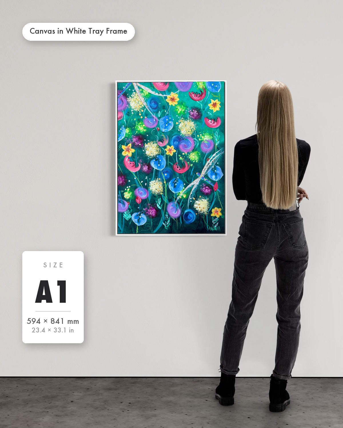 Andrea Nicole 'Things Still Bloomed' fine art canvas in a white tray float frame, A1 — shown to scale on a gallery wall with a size guide card. | an:family=canvas;role=sizeref;size=A1;finish=white