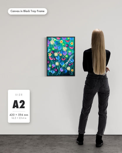 Andrea Nicole 'Things Still Bloomed' fine art canvas in a black tray float frame, A2 — shown to scale on a gallery wall with a size guide card. | an:family=canvas;role=sizeref;size=A2;finish=black