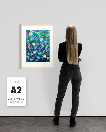 Things Still Bloomed — A2 (420 x 594 mm) natural frame art print shown to scale beside a person, with a size guide card. | an:family=print;role=sizeref;size=A2;finish=natural