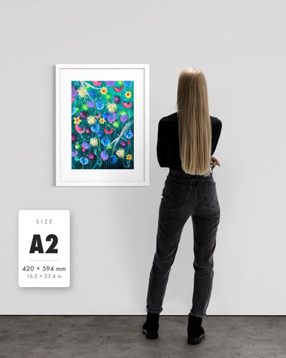 Things Still Bloomed — A2 (420 x 594 mm) white frame art print shown to scale beside a person, with a size guide card. | an:family=print;role=sizeref;size=A2;finish=white