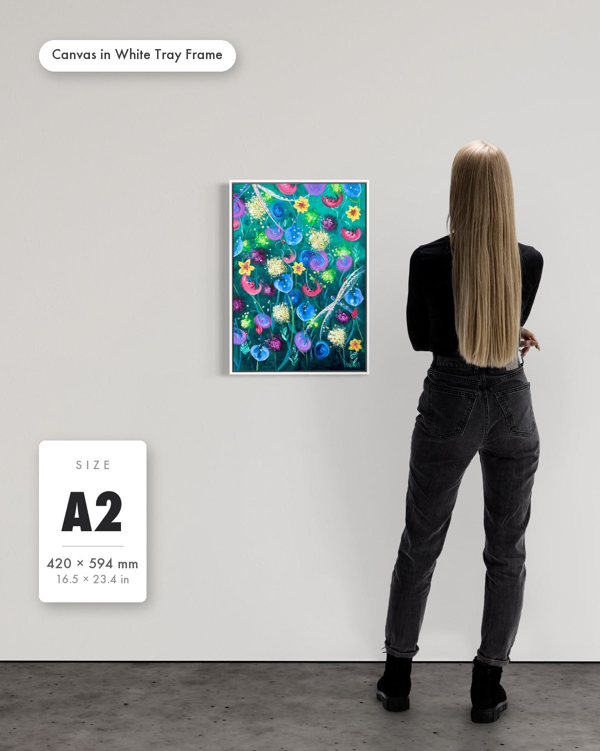 Andrea Nicole 'Things Still Bloomed' fine art canvas in a white tray float frame, A2 — shown to scale on a gallery wall with a size guide card. | an:family=canvas;role=sizeref;size=A2;finish=white
