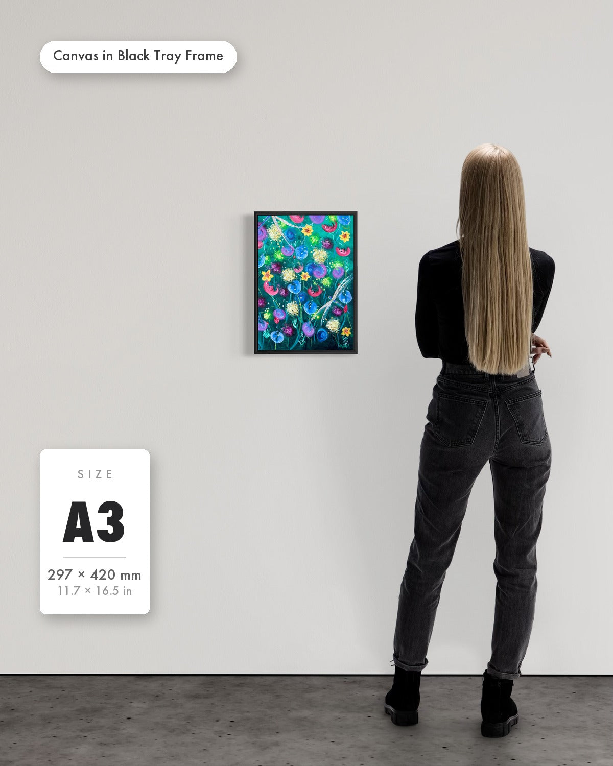 Andrea Nicole 'Things Still Bloomed' fine art canvas in a black tray float frame, A3 — shown to scale on a gallery wall with a size guide card. | an:family=canvas;role=sizeref;size=A3;finish=black