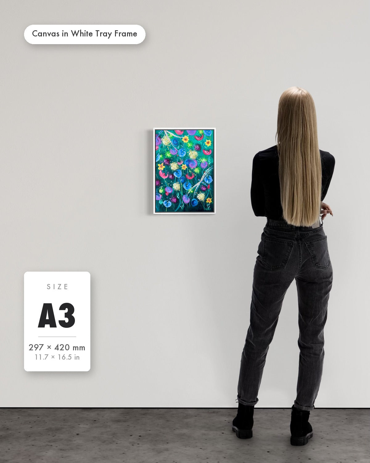 Andrea Nicole 'Things Still Bloomed' fine art canvas in a white tray float frame, A3 — shown to scale on a gallery wall with a size guide card. | an:family=canvas;role=sizeref;size=A3;finish=white