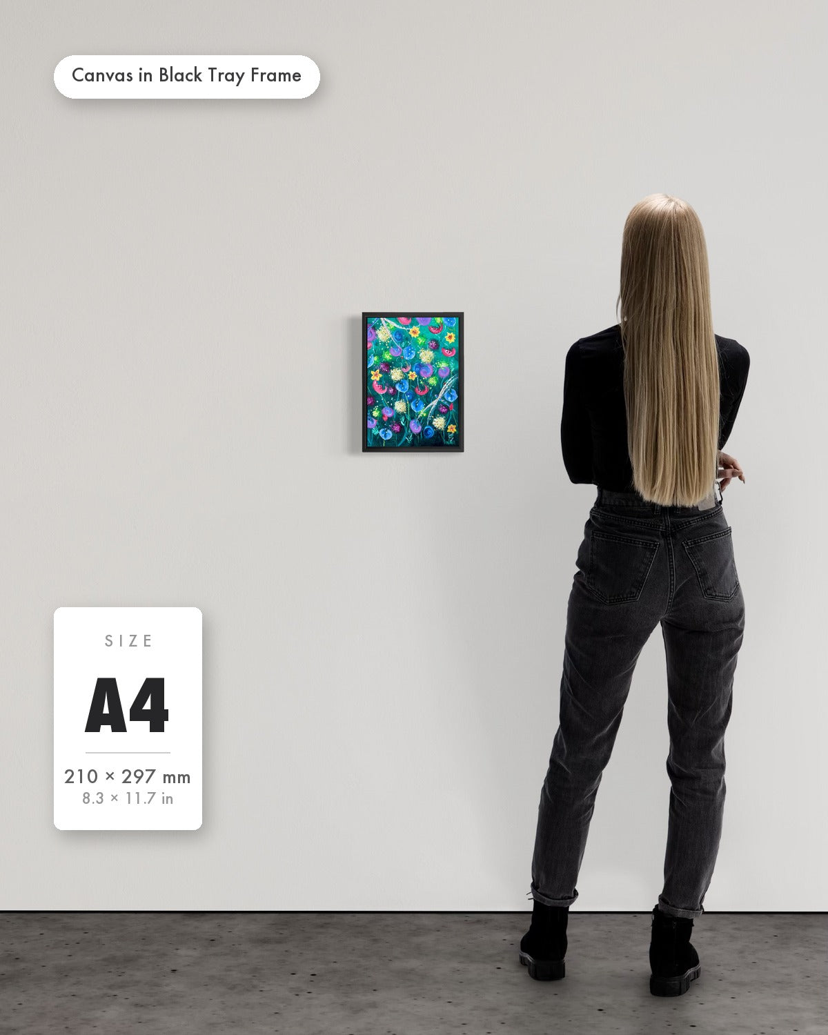 Andrea Nicole 'Things Still Bloomed' fine art canvas in a black tray float frame, A4 — shown to scale on a gallery wall with a size guide card. | an:family=canvas;role=sizeref;size=A4;finish=black
