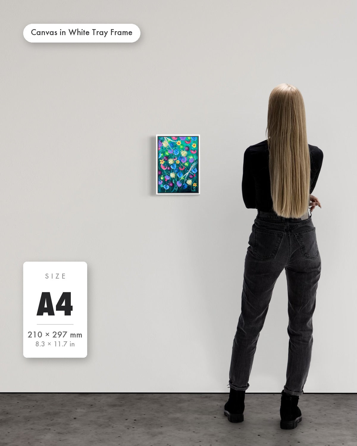 Andrea Nicole 'Things Still Bloomed' fine art canvas in a white tray float frame, A4 — shown to scale on a gallery wall with a size guide card. | an:family=canvas;role=sizeref;size=A4;finish=white