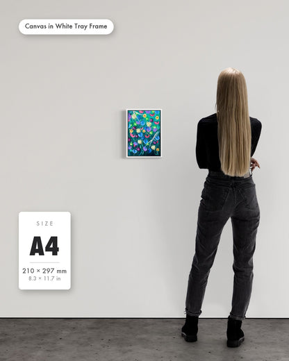 Andrea Nicole 'Things Still Bloomed' fine art canvas in a white tray float frame, A4 — shown to scale on a gallery wall with a size guide card. | an:family=canvas;role=sizeref;size=A4;finish=white