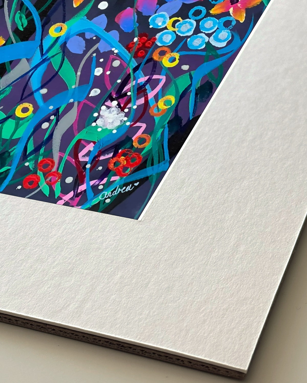 Andrea Nicole 'Twilight' giclée fine art print in an off-white window mount, shown corner-on so the bevel-cut window opening, 100% cotton paper and mount board are visible. | an:family=print;role=mount