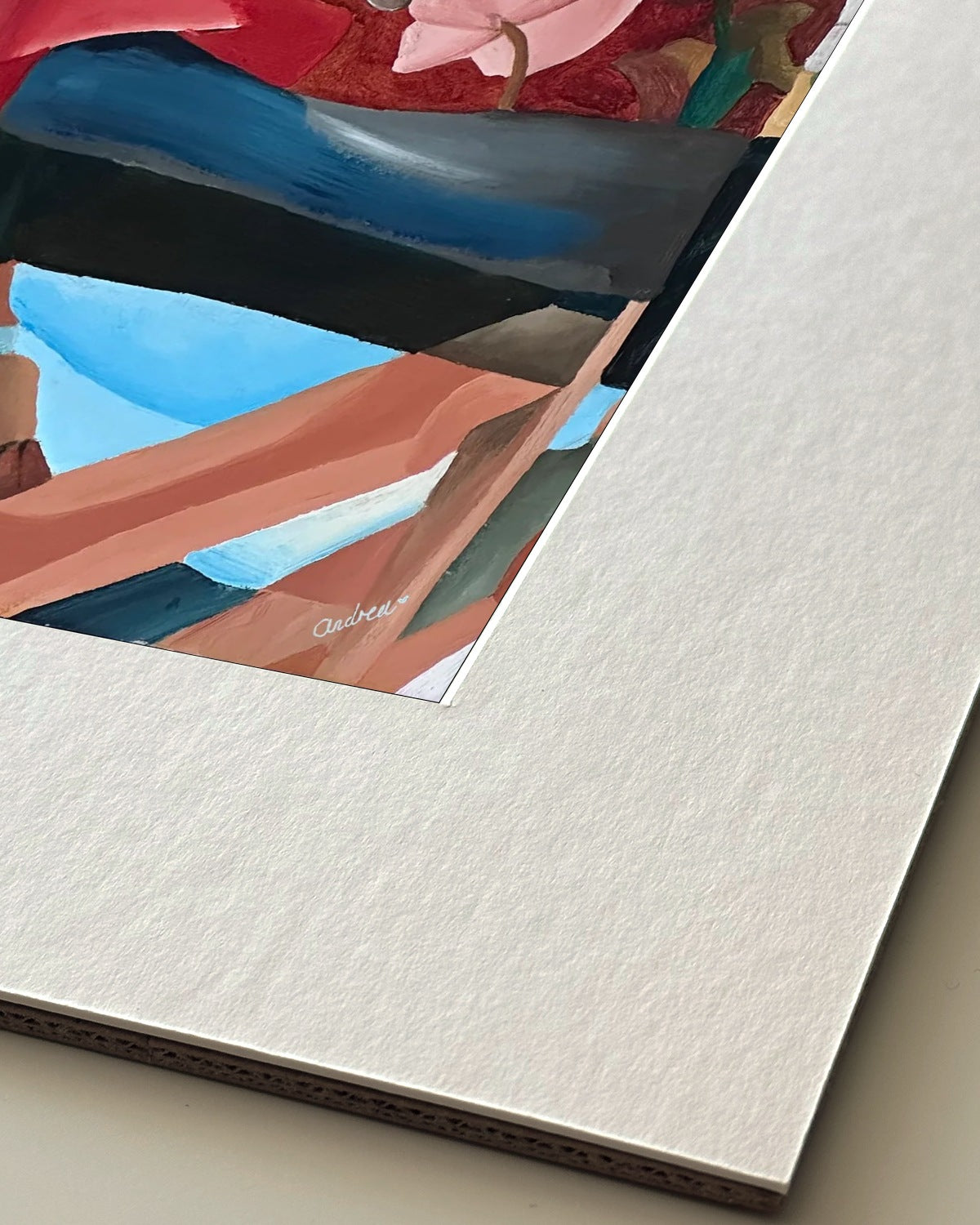 Andrea Nicole 'Waiting For Me' giclée fine art print in an off-white window mount, shown corner-on so the bevel-cut window opening, 100% cotton paper and mount board are visible. | an:family=print;role=mount